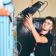 Young person carrying a CAT cable.