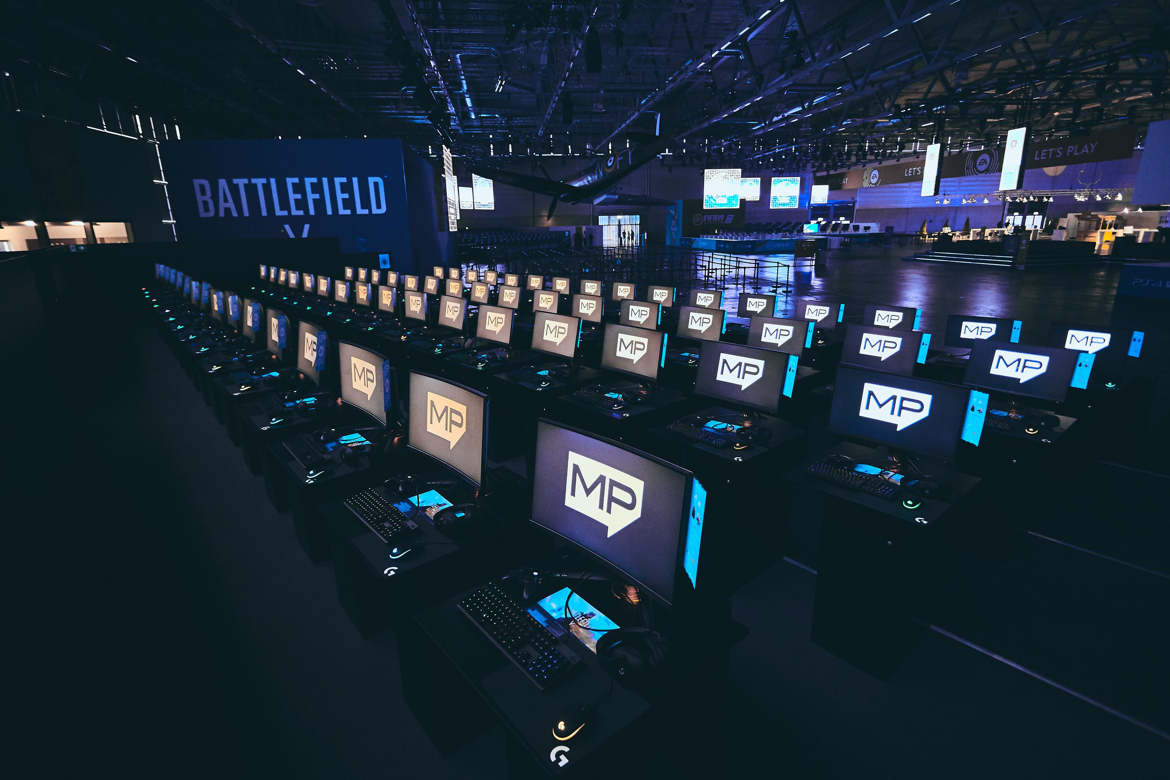 PC gaming stations at the Gamescom booth of Electronic Arts
